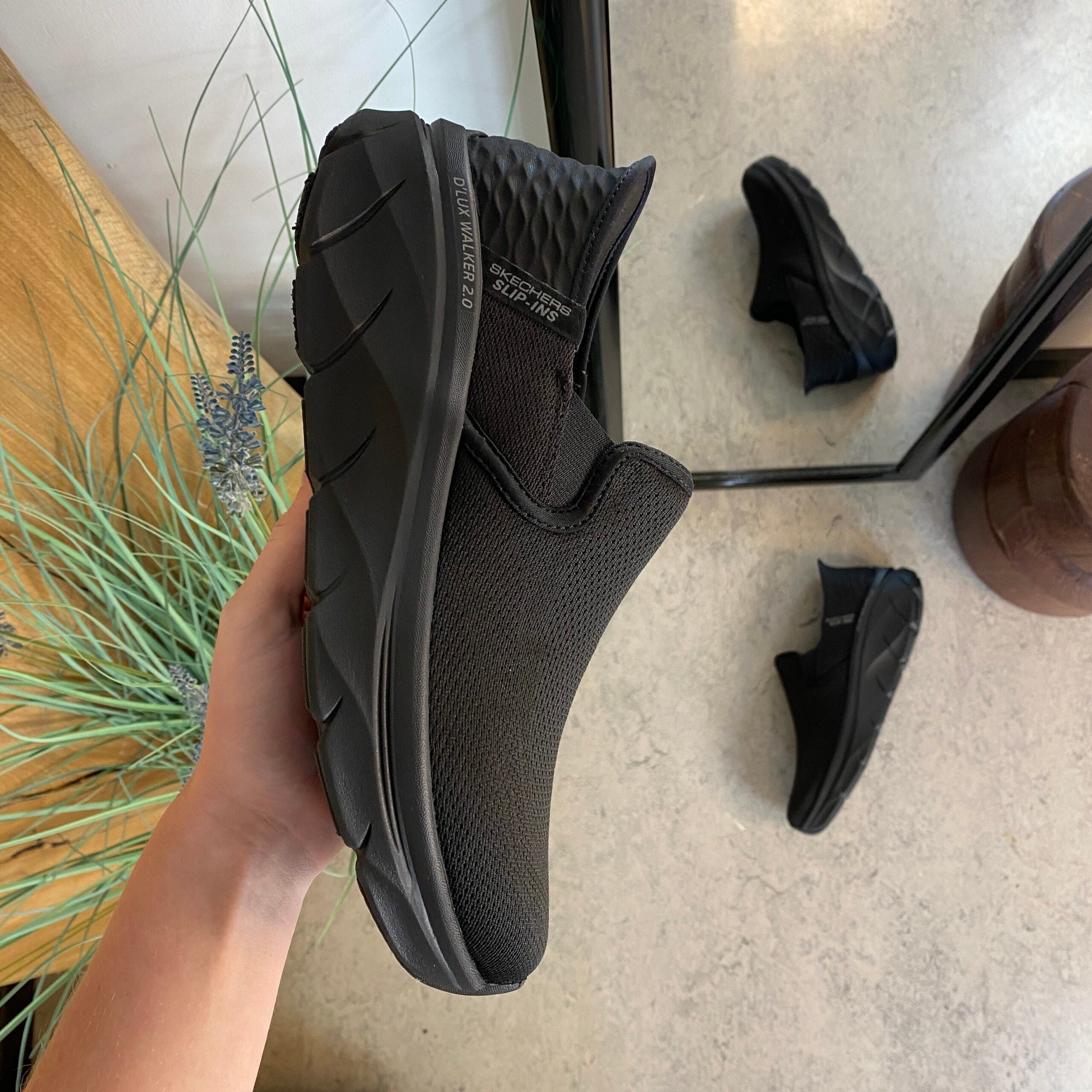 Svart herre slip-on-sko fra Skechers