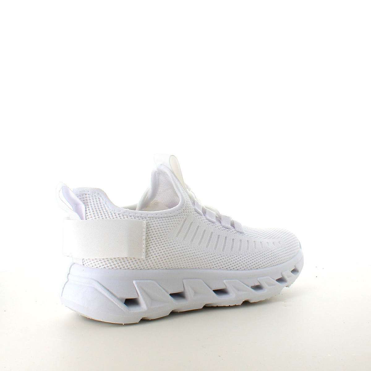 Hvite slip-on-sko med strikket overdel