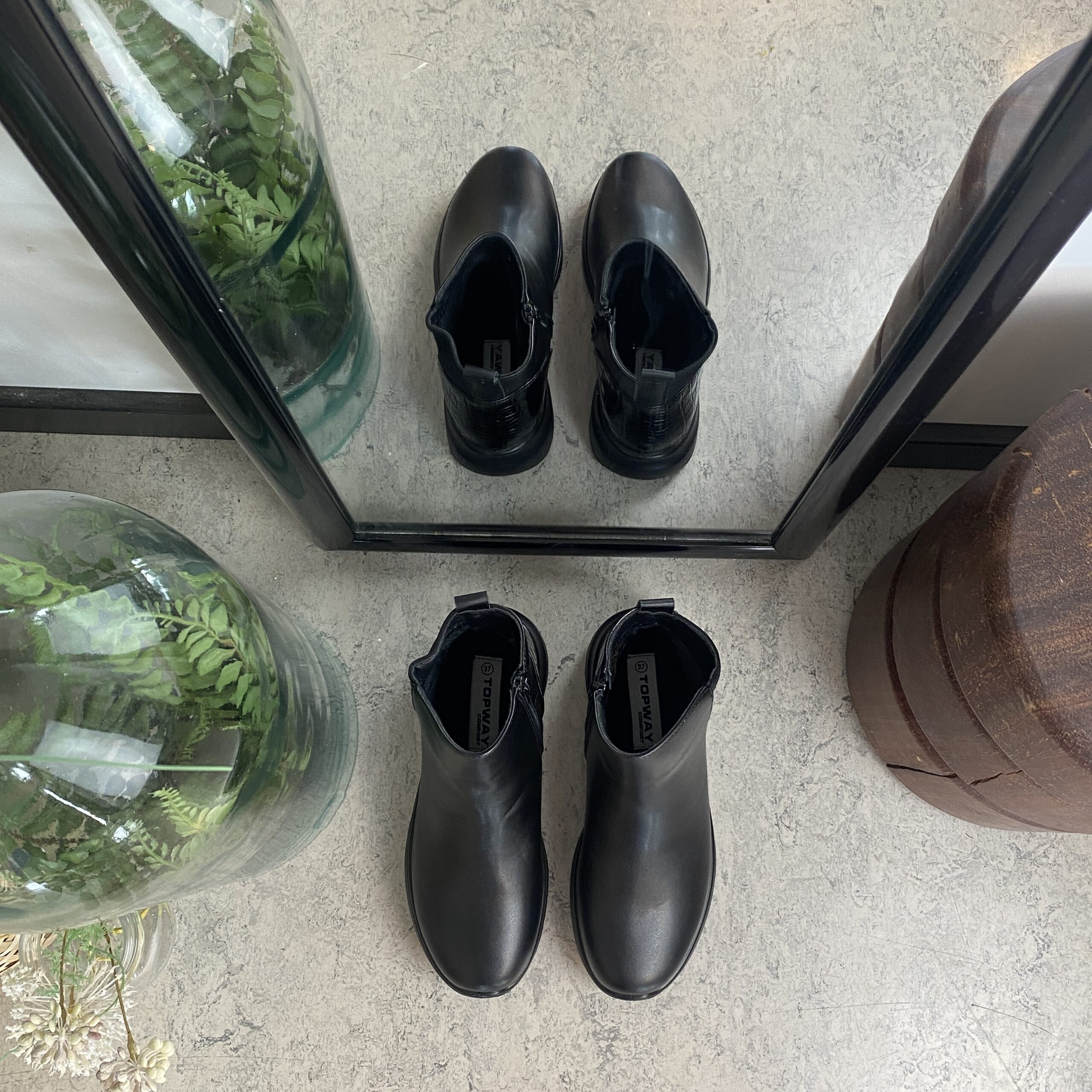 Svart støvel med glidelås